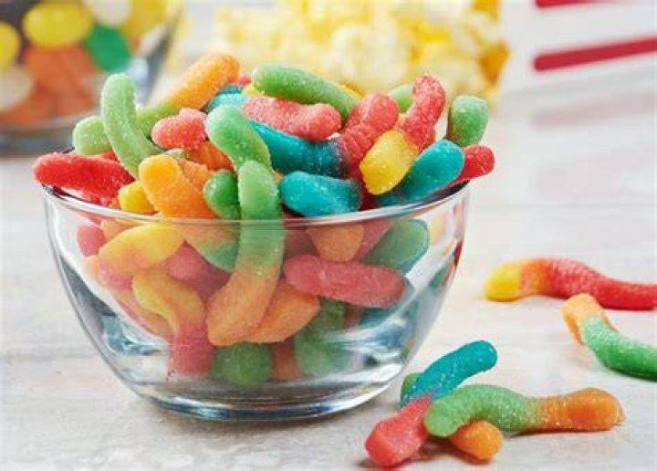 How are sour gummy worms made?