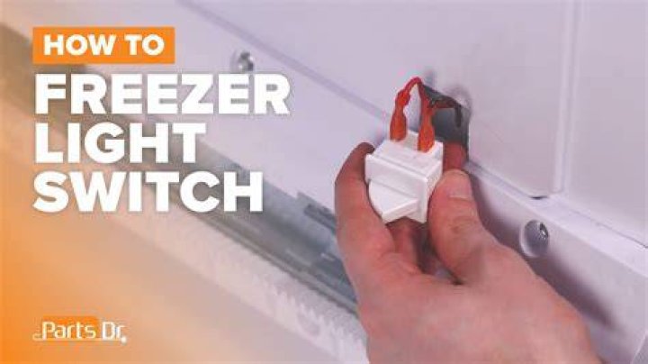 How does a refrigerator light switch work?